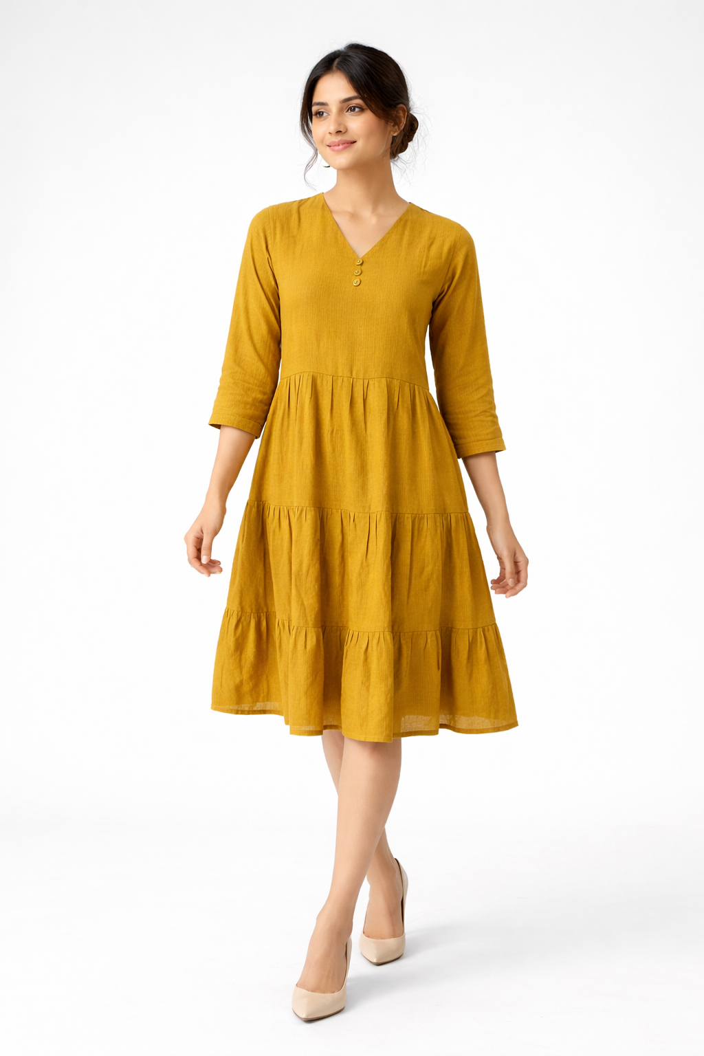 Bright and effortlessly stylish, this mustard yellow dress features a flowy tiered silhouette for a soft, feminine look.