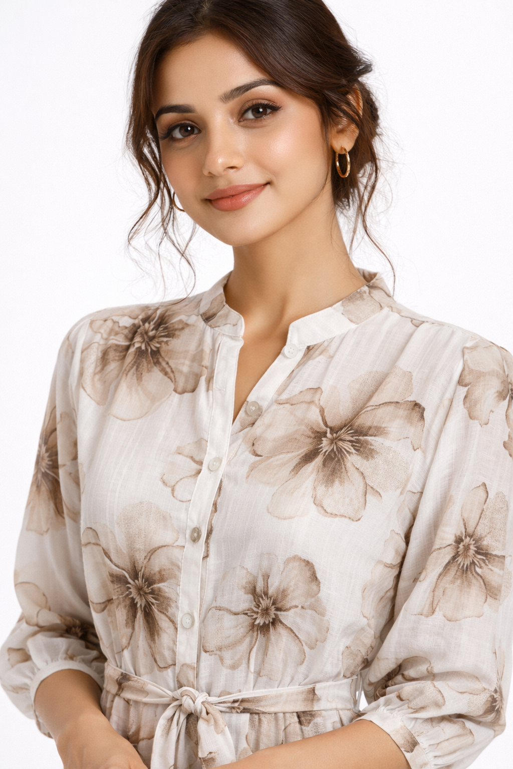 Graceful and feminine, this beige floral dress features a soft flowy silhouette with delicate prints.