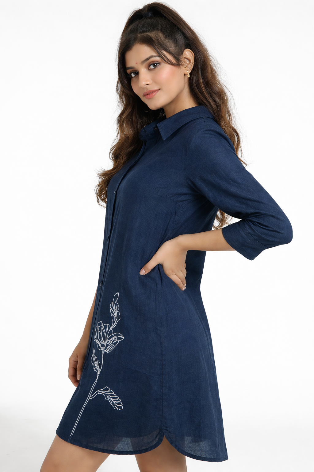 Elegant and effortlessly stylish, this navy blue shirt dress features a sleek silhouette with subtle white floral embroidery for a refined touch.