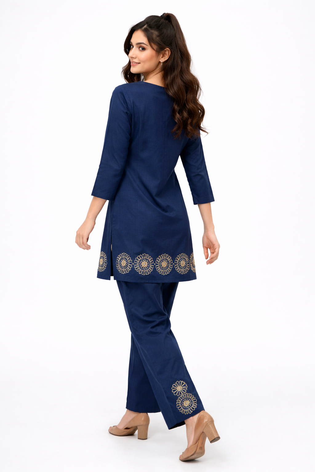 Two-piece co-ord set with intricate cutwork floral embroidery at the neckline and hem.