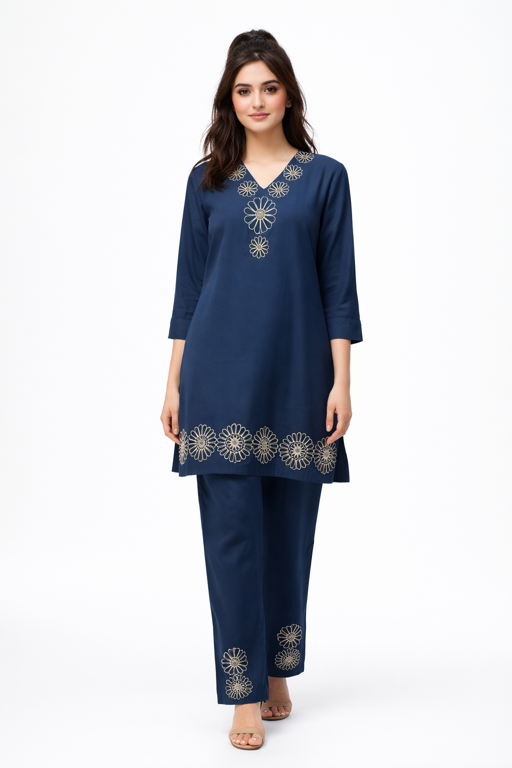 Two-piece co-ord set with intricate cutwork floral embroidery at the neckline and hem.