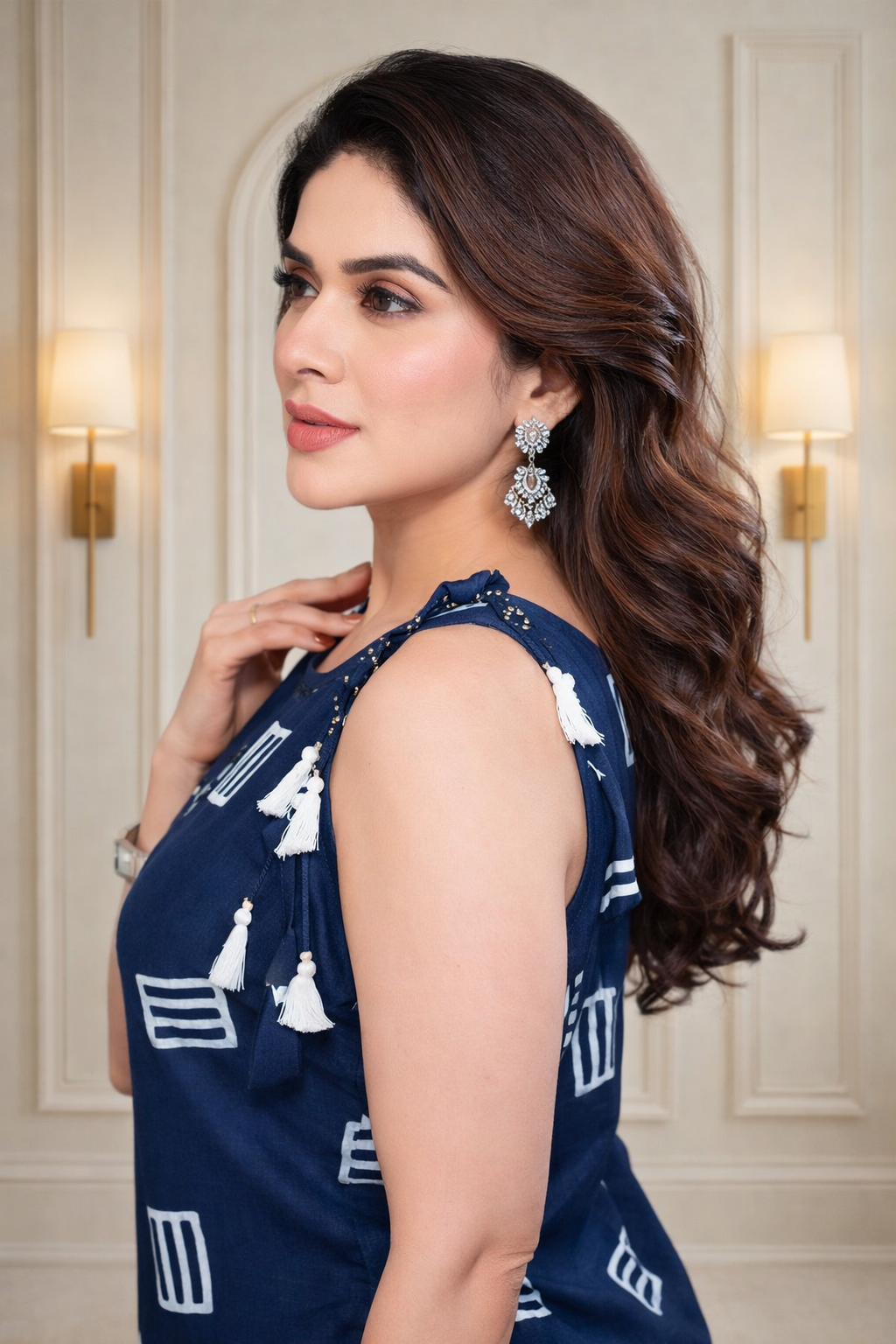 Stylish navy-blue sleeveless kurta with modern prints and delicate tassel detailing.