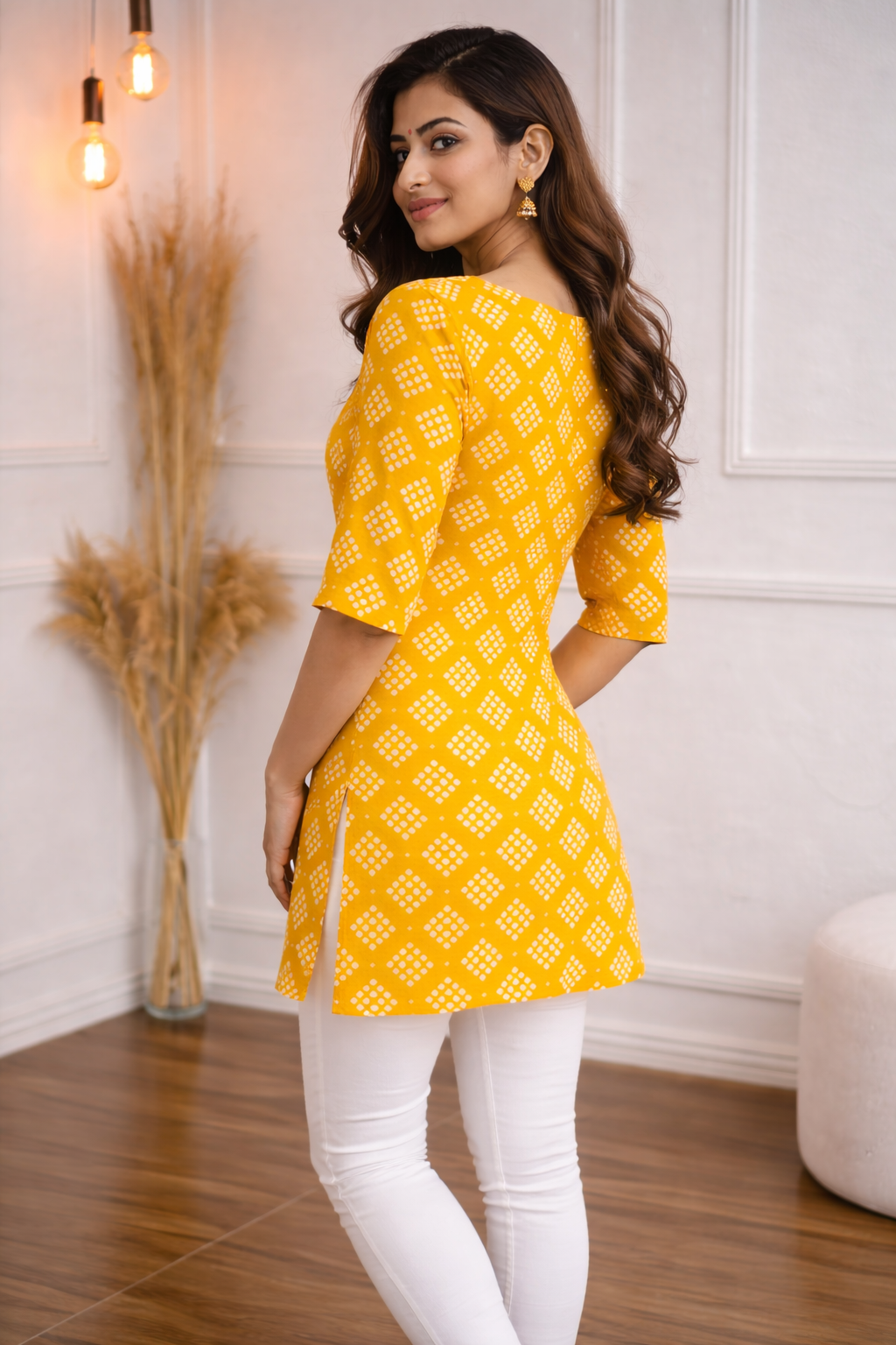 Mustard yellow short kurta featuring a subtle V-notch round neck and elegant white geometric print.