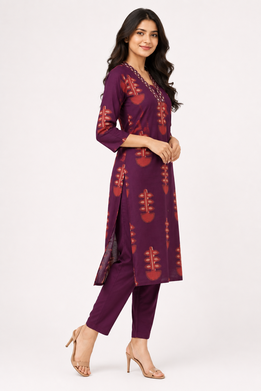 Elegant wine-colored straight kurta pant set featuring an all-over traditional printed design.