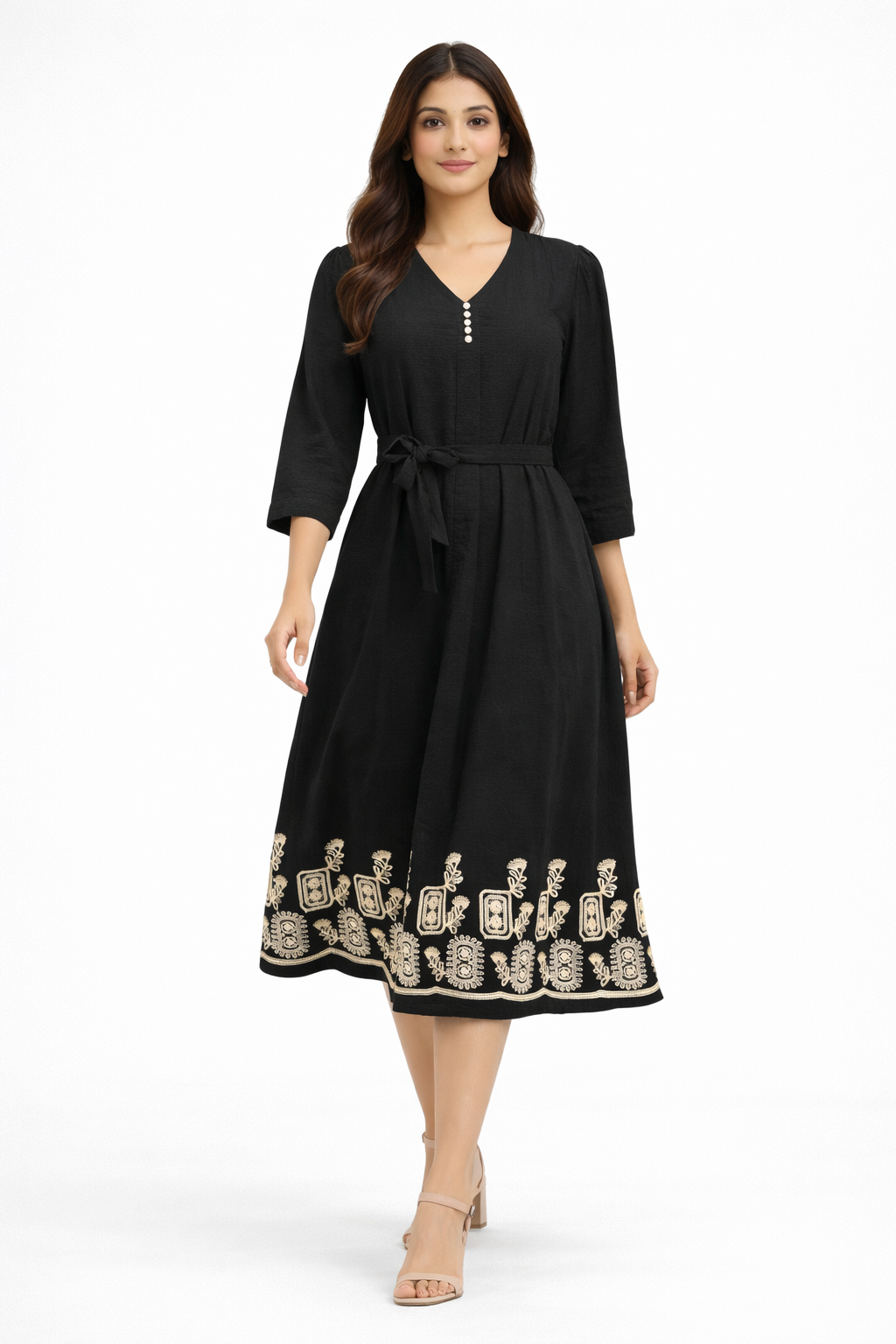 Black midi dress features a flattering flowy silhouette with a delicate beige embroidered border