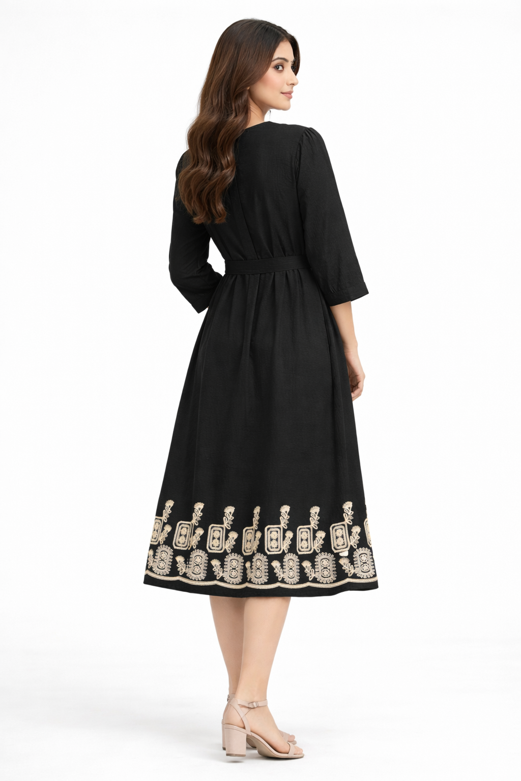 Black midi dress features a flattering flowy silhouette with a delicate beige embroidered border