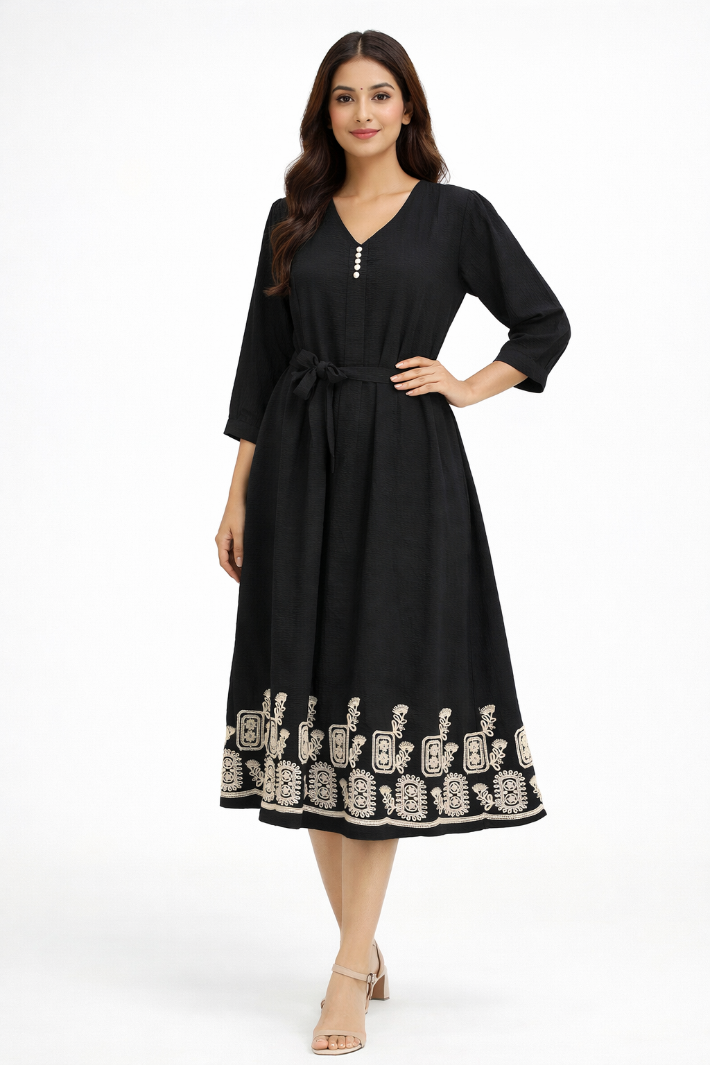 Black midi dress features a flattering flowy silhouette with a delicate beige embroidered border