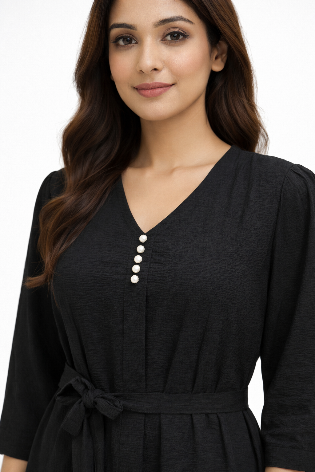 Black midi dress features a flattering flowy silhouette with a delicate beige embroidered border
