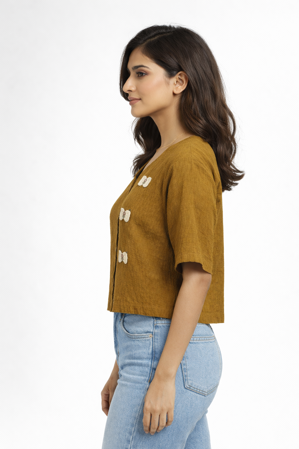 Top featuring a V-Neck line and short sleeves. Designed with finished h a relaxed silhouette and with a contrasting all-over abstract print Brown